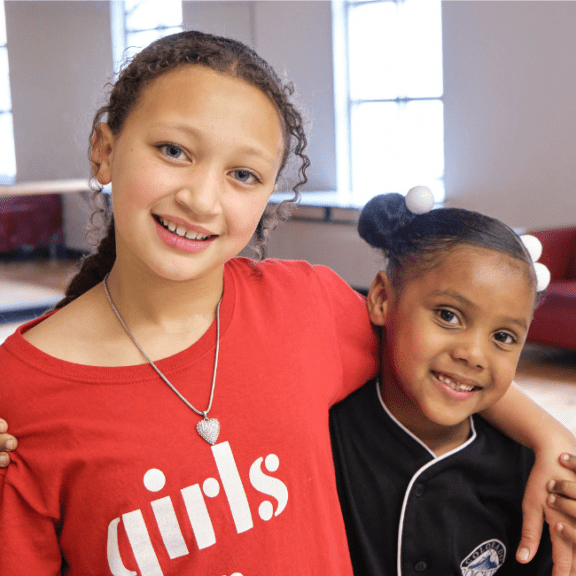 Image of two girls hugging.