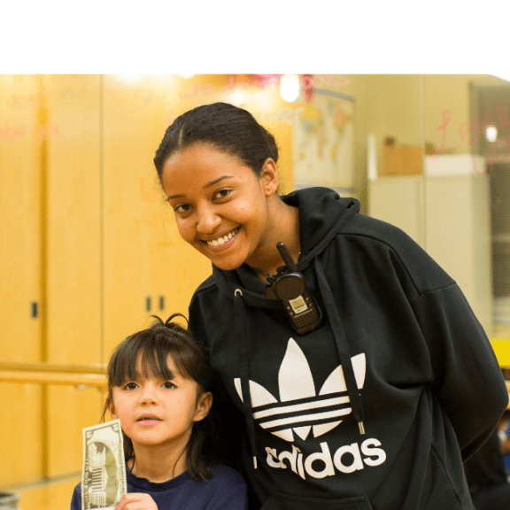 Young woman smiling with a young girl