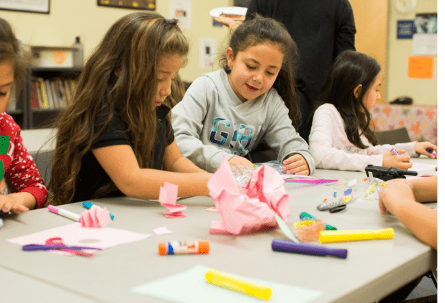 Young girls working on a crafting activity