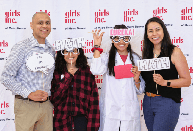 Girls Inc. girls and their parents smiling while attending our Eureka-thon event