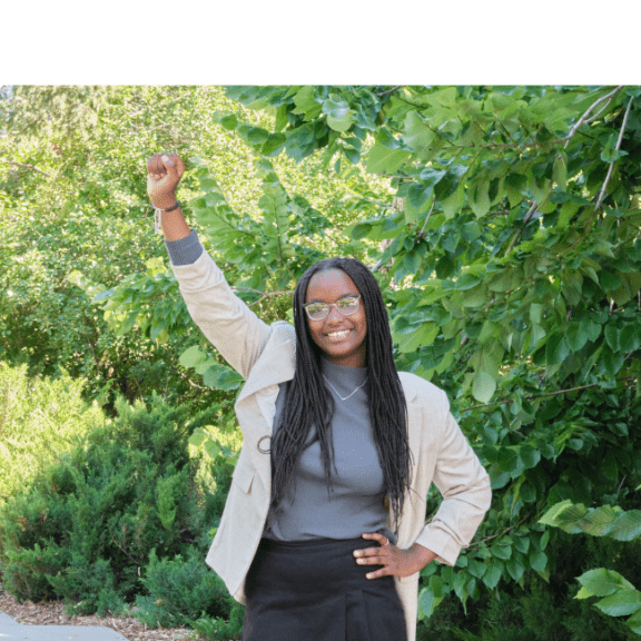 Teen raising her fist in the air.