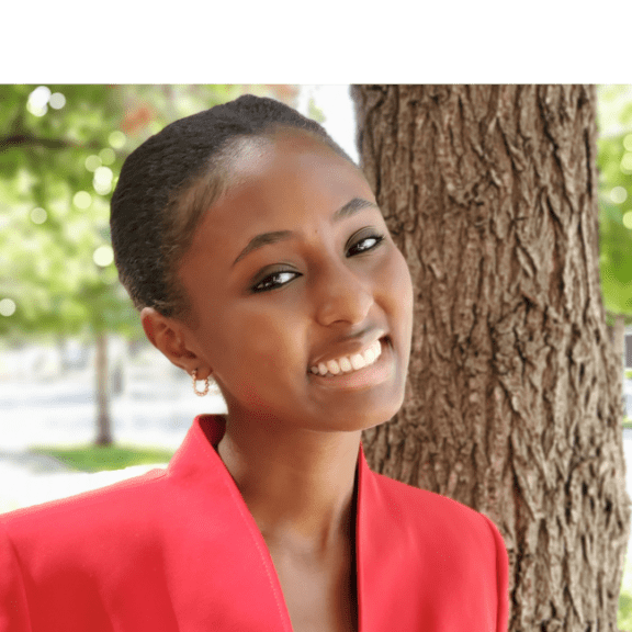 Professional headshot of a Bold Business teen participant in a red blazer.