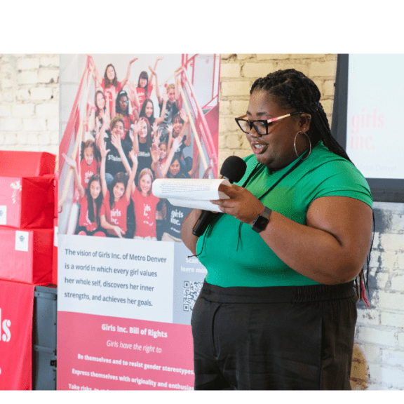 Girls Inc. alum gives a speech during Girls Inc.'s College Shower event