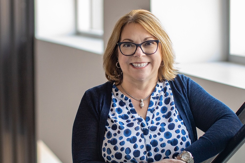 Balancing the Books and Breaking Barriers: Lori Palazzolo’s Legacy